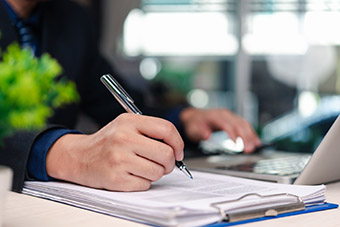 businessman signning documents