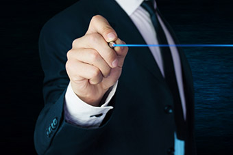 man writing with blue ink on screen
